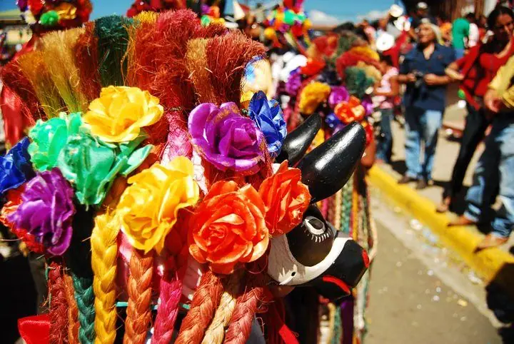 Flowered, ribboned hats from El Güegüense at the Diriamba festival